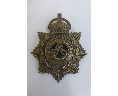 An early 20th Century Oxfordshire Regiment helmet plate with centre, retains its lugs to the reverse, approximately 5 x 4 3/4