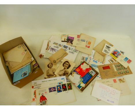 A box of first day covers, mint stamps, Royal Mail greeting stamps, etc.