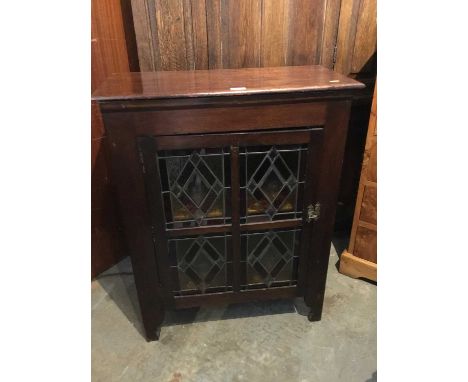 Victorian mahogany cupboard with stained glass panels on bracket feet. 68 cm wide, 86 cm high, 32 cm deep