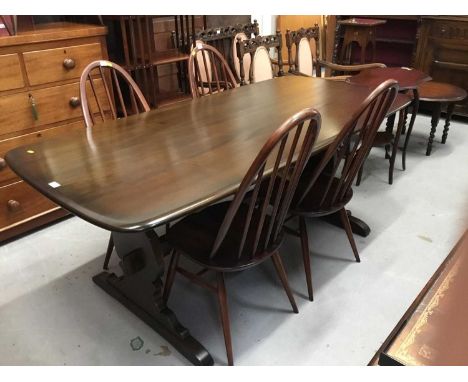 Ercol refectory dining table and six matching stickback chairs