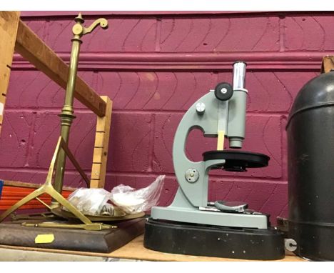 Brass set of scales and a microscope