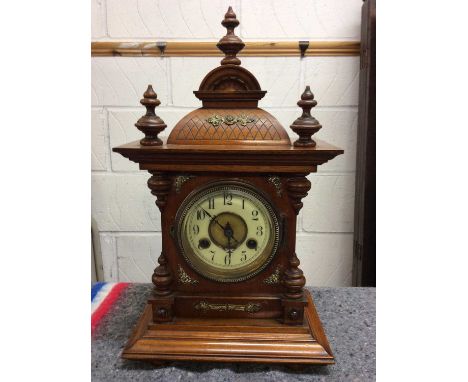 Walnut mantle clock with brass decoration