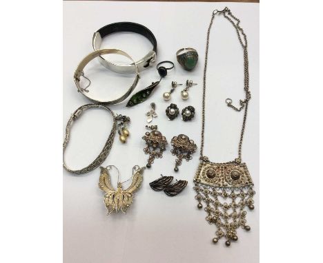 Jewellery box containing silver and white metal jewellery including silver bangle, silver cross pendant, pairs of earrings an