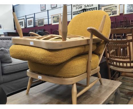 Ercol stick back easy chair with matching stool with orange cushionsCondition report: Good overall condition, some scratching