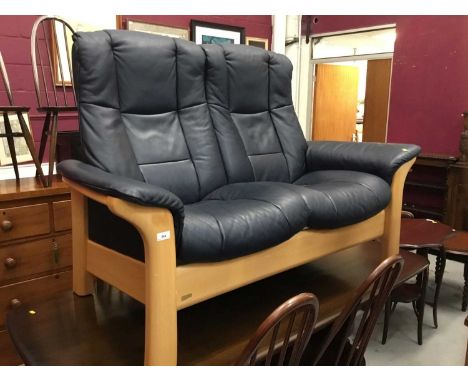 Stressless navy leather reclining armchair and matching sofa and footstool