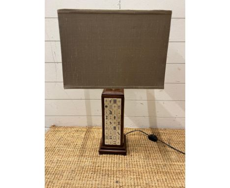 A table lamp with mahjong tiles to centre 