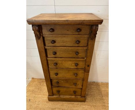 A light oak Wellington chest with graduating drawers (H104cm W51cm D36cm)