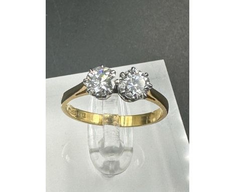 A double diamond engagement ring on yellow gold, marked 750.