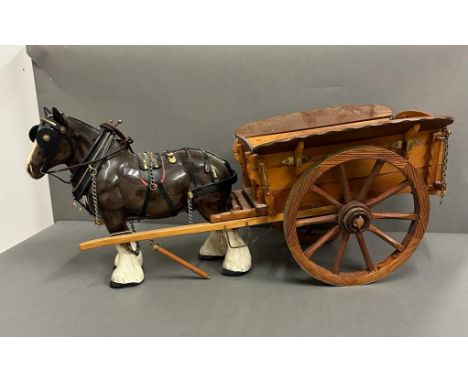 A ceramic horse and cart 