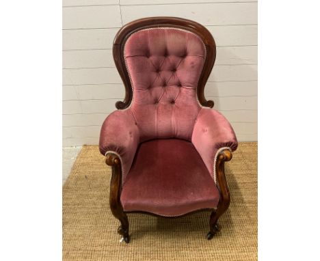A Victorian arm chair with button back 