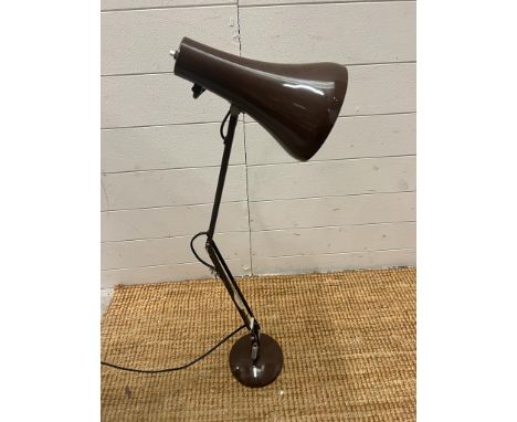 A brown angle poise light 