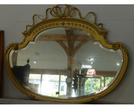 A gilt shaped ribbon top mirror - Height 89 cm x Width 1.13 m