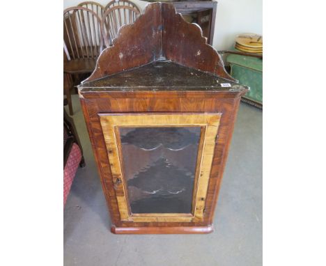 A Georgian Oyster veneered corner cupboard with later glazed panel - Height 1.08 m x Width 57 cm 