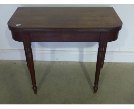 A late 19th century mahogany and ebony line inlaid card table, the D end top folding over supported by gateleg action raised 