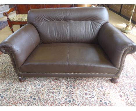 A circa 1900's two seater sofa - newly re-upholstered in brown leather with brass studding - Height 83 cm x Width 154 cm x De