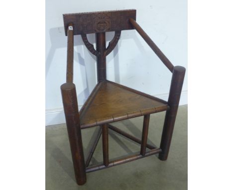 An oak Warwick chair with carved back - initialled Q M P