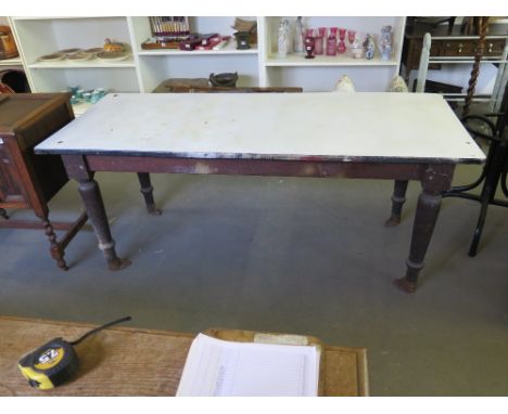 An enamel metal topped pine kitchen table raised on turned supports - Length 183cm  x Width 77cm  x  Height 76cm 