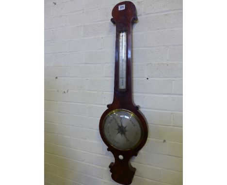 A mahogany veneered onion top barometer with a silvered thermometer with fahrenheit scale over silvered dial 