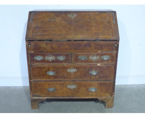 A 17th/18th century walnut four drawer bureau with a fitted interior and well - Height 1.11 m x Width 97 cm x Depth 55 cm
