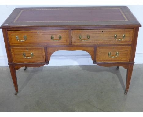 An Edwardian inlaid mahogany writing table/desk - the top with a leather writing surface, four drawers with satinwood banding