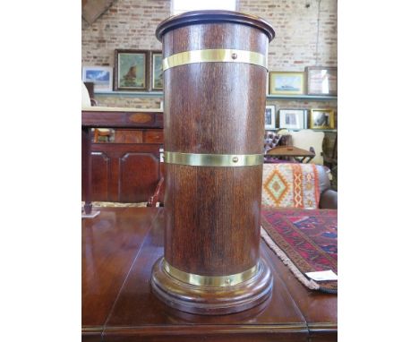 A circular oak brass bound stick stand with liner  - Height 66 cm x Diameter 30cm 