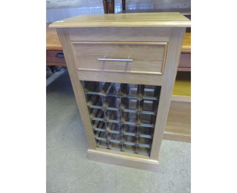A light oak wine rack - holding twenty four bottles