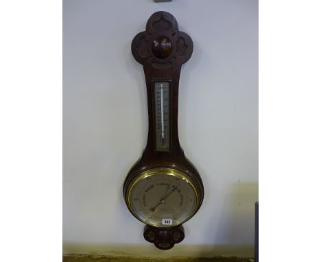 An early 20th century oak barometer - 8" dial with thermometer above by R and J Beck London 
Condition report: Working 
