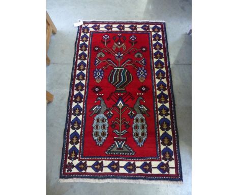 A vintage Mahal runner with geometric flower heads on red field - 10' x 3'5"
