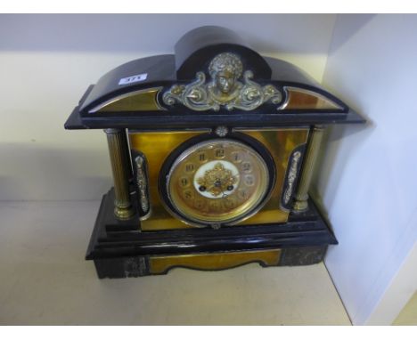A late Victorian slate and brass architectural mantle clock - Height 35 cm x Width 38cm  with pendulum and key