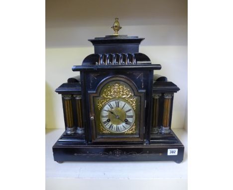 An ebonised case fourteen day mantel clock with brass dial by H.A.C. - strikes on gong
Condition report: Working