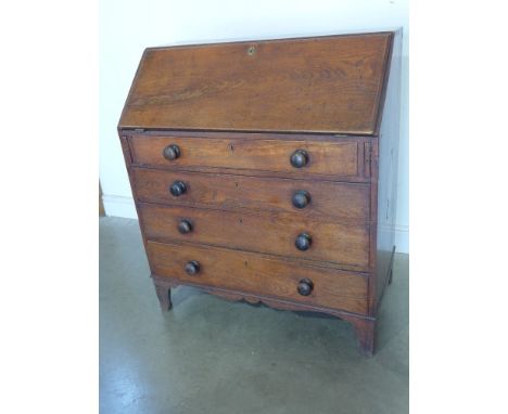A 19th century elm four drawer bureau on bracket feet - Height 1.09 m x Width 95 cm x Depth 52 cm 