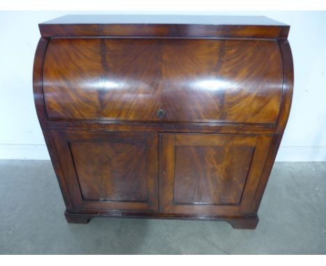 A 19th century mahogany cylinder top bureau with a fitted classical interior over a writing slide and five drawers - Height 1