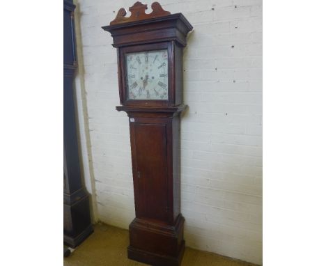 An 8 day longcase clock with a painted dial with a seconds hand in an oak case 
Condition report:  With key and pendulum but 