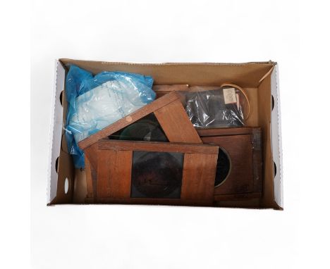A quantity of magic lantern slides, including a moving slide. Condition - poor to fair.