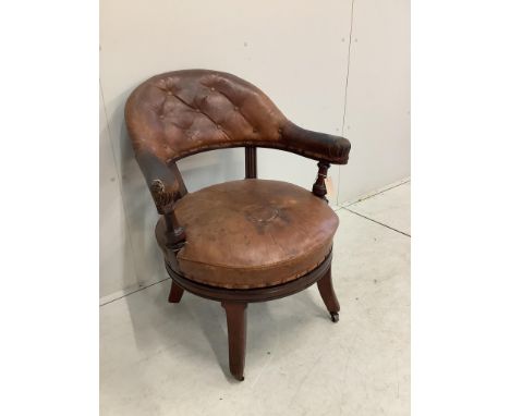 A 19th century Holland &amp; Son leather button back office chair (missing one castor), width 65cm, depth 56cm, height 80cm. 