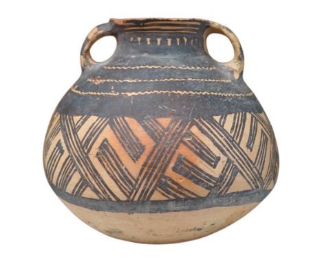 A Chinese neolithic pottery two handled jar - 14cm tall. Condition - fair to goodProvenance: the vendor‘s parents lived in Ho