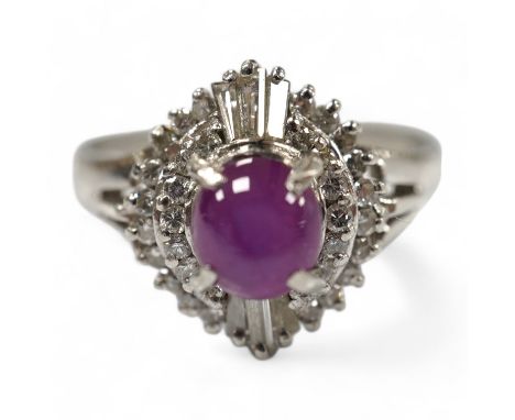 A modern platinum, star ruby and diamond cluster set dress ring, size J/K, gross weight 4.7 grams. Condition - fair to good