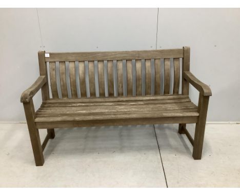 A weathered teak slatted garden bench, width 146cm, depth 52cm, height 92cm. Condition - good but weathered