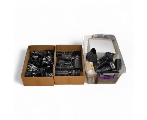 Ten SLR camera bodies by Nikon, Olympus, Canon, Pentax, etc., together with twelve lenses by Nikon, Minolta, Tamron, Vivitar 