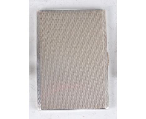 A late Art Deco silver engine turned pocket cigarette case, having gilt washed interior and later inscribed, maker E.J. Trevi