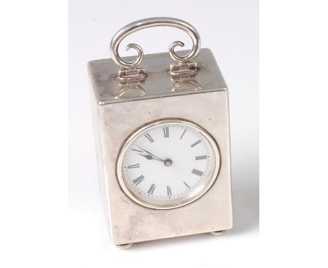 An Art Nouveau silver cased minuet carriage clock, having scroll swing hinged carry handle, 3.5cm white enamel dial, on cushi