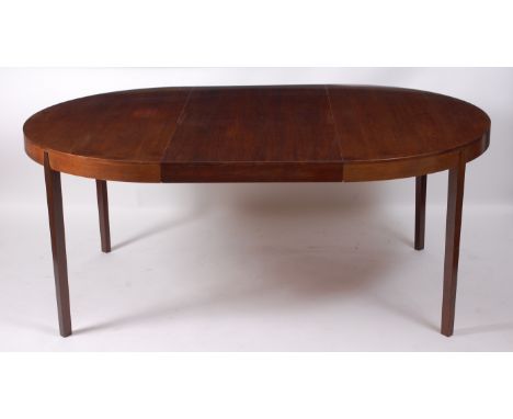 A 1960s rosewood extending dining table by Møbler, the D-ends with pull-out action and single extra drop-in leaf, h.73cm, max