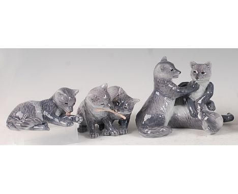 A Royal Copenhagen porcelain model of three Arctic foxcubs, in playful pose, printed backstamp and numbered 444 verso, w.18.5