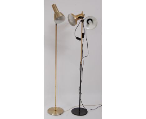 A 1970s Danish gilt brushed brass and black enamelled metal twin floor lamp, having adjustable fittings, h.139cm; together wi