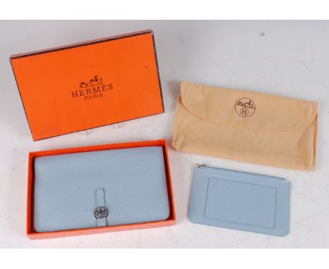A Hermès of Paris Dogon recto verso blue Celeste clutch wallet, with interior pockets including card holders, lined in silk, 