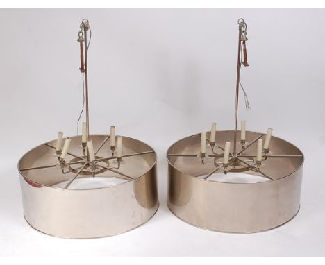 Charles Edwards - a pair of large chromed metal 'drum' circular ceiling lights, each with six light fitted sconces, dia.80cm,