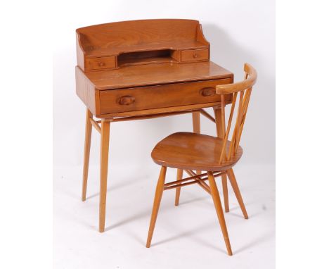 A 1960s Ercol blond elm writing bureau, having integral raised superstructure, with twin short drawers, the single long friez