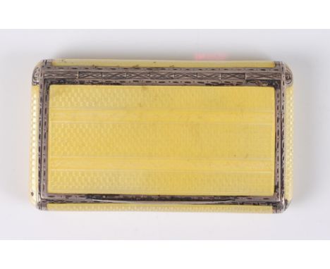 An Art Deco silver and yellow guilloche enamel box, the hinged cover with gilt washed interior, with rounded sides, maker H.C