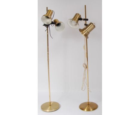 A 1970s Danish gilt brushed brass twin floor lamp, with lower domed adjustable shades, h.132cm; together a similar example wi