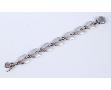 A silver bracelet by Harald Nielsen for Georg Jensen, no. 93, the tulip shaped links with round clasp stamped 'Georg Jensen, 